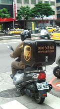 ups-delivery-guy on vespa